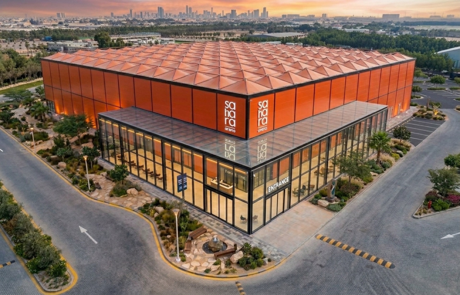 Aerial view of Sahara Arena's terracotta roof and glass entrance pavilion